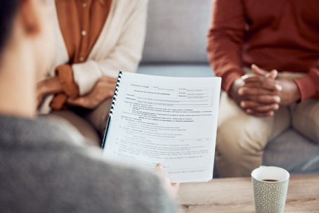 couple reviewing documents with a lawyer