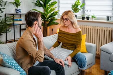 couple having a serious discussion at home