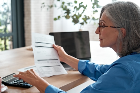 older woman looking at retirement account