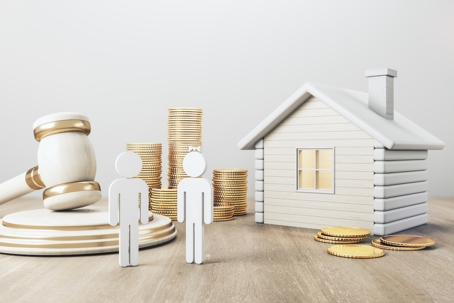 White house with golden coin stacks, male, female and gavel on concrete and wooden background
