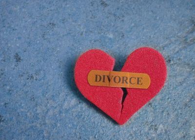 broken heart held together by a bandage with the word "divorce" on it